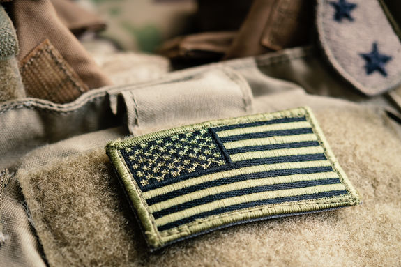 Green US flag patch on the tactical bulletproof vest Green US flag patch on the tactical bulletproof vest